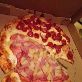 Joey's Pizza - Pineapple and pepperoni pizza - A pizza topped with cherry tomatoes, ham, pineapple chunks, and cheese slices, served in a pizza box. - Pizza Near Me - Springfield, Oregon