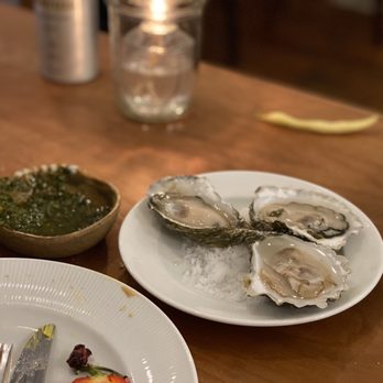 FLX Table - a plate of oysters and a bowl of pesto sauce - New American Near Me - Geneva, New York