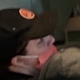 1 of several employees not covering nose and mouth.    Not a temporary removal - working without nose and mouth covered.