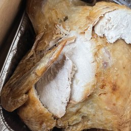 a roast chicken in a foil pan