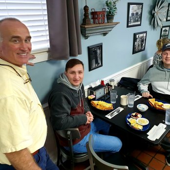 The Village Cafe - Owner Keith, super guy and host with happy customers at breakfast.  Try it out and become a regular.  Support local. - American Near Me - Pinehurst, North Carolina