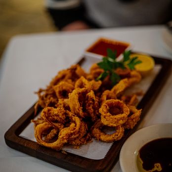 Il Fornaio - a plate of fried squids and dipping sauce - Italian Near Me - Irvine, California Il Fornaio - a plate of fried squids and dipping sauce - Italian Near Me - Irvine, California