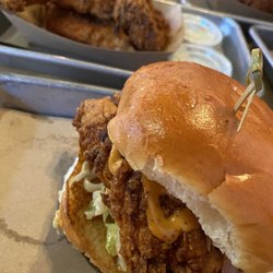 The Rub Chicken & Beer - Hot chicken sandwich with tenders in back