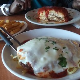 The eggplant parmesan was served hot and in Good portions