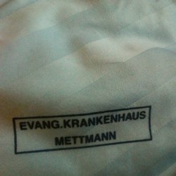 Evangelisches Krankenhaus Mettmann - Bettwäsche gestempelt.