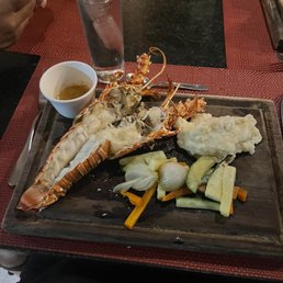 Pic is deceiving. This was no longer my hand. This plate of food was 100.$. Pic taken as soon as I received it. So disappointing.
