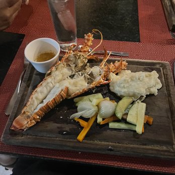Toscana Grill - Pic is deceiving. This was no longer my hand. This plate of food was 100.$. Pic taken as soon as I received it. So disappointing. - Seafood Near Me - Playa del Carmen, ROO