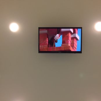 Smith And Bailey Dental - Overhead TV playing Chicken Little during procedures - General Dentistry Near Me - Rainbow City, Alabama Smith And Bailey Dental - Overhead TV playing Chicken Little during procedures - General Dentistry Near Me - Rainbow City, Alabama