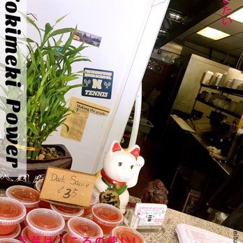 Chinese Kitchen - a table with cups of tea and a cat figurine - Chinese Near Me - New Britain, Connecticut