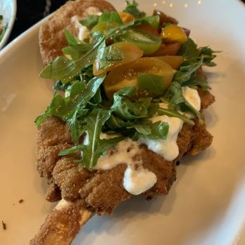 Rossoblu - Fried veal topped with burrata, tomatoes and arugula - Italian Near Me - Los Angeles, California Rossoblu - Fried veal topped with burrata, tomatoes and arugula - Italian Near Me - Los Angeles, California