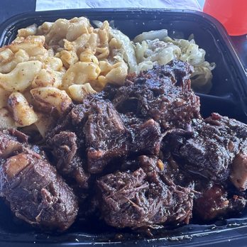 Tev's kitchen - Oxtails. Served with Mac and cheese, rice and peas, cabbage, and a drink. - Soul Food Near Me - Los Angeles, California Tev's kitchen - Oxtails. Served with Mac and cheese, rice and peas, cabbage, and a drink. - Soul Food Near Me - Los Angeles, California