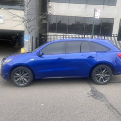 Next Level Auto Body Shop - There was a huge scratch from tire to tire and massive dents. Curb rash on the tires. They also were able to customize my brake calipers