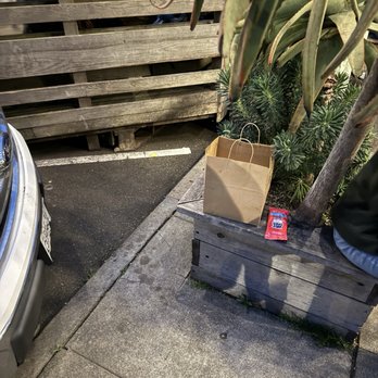 Hook Fish - Ate sitting on a planter between a Ford F-150 and an Aloe Vera plant. - Seafood Near Me - San Francisco, California