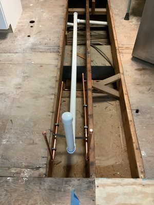 New Kitchen Island Plumbing Project - Our customer wished to move his plumbing from the corner of his kitchen to the new island he had installed. During the first trip we turned the water off at the main in street, drained the system, cut 1 1/2” pipe and redirected them to island, cut 1/2 copper lines and redirected to island and finally capped lines until the counter top subcontractor completed their portion. When we returned for the second trip, we completed the final work underneath kitchen sink. This included installing the faucet, garbage disposal, dishwasher and cut off valves underneath the sink.
Cut water lines and install face covers and cut off valves also hook up trap and studor vent for drain pipe turn water New Kitchen Island Plumbing Project - Our customer wished to move his plumbing from the corner of his kitchen to the new island he had installed. During the first trip we turned the water off at the main in street, drained the system, cut 1 1/2” pipe and redirected them to island, cut 1/2 copper lines and redirected to island and finally capped lines until the counter top subcontractor completed their portion. When we returned for the second trip, we completed the final work underneath kitchen sink. This included installing the faucet, garbage disposal, dishwasher and cut off valves underneath the sink.
Cut water lines and install face covers and cut off valves also hook up trap and studor vent for drain pipe turn water