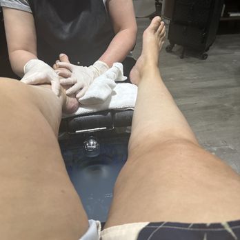 Solar Nails - Getting lotion massage pedicure - Nail Salons Near Me - Keizer, Oregon