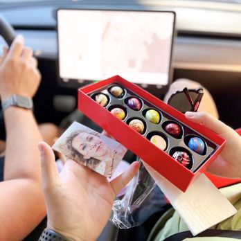 Kate Weiser Chocolate - a woman holding a box of chocolates - Candy Stores Near Me - Dallas, Texas Kate Weiser Chocolate - a woman holding a box of chocolates - Candy Stores Near Me - Dallas, Texas
