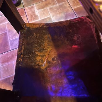 Pueblito Viejo - Broken chair that we were seated at - Colombian Near Me - Miami, Florida Pueblito Viejo - Broken chair that we were seated at - Colombian Near Me - Miami, Florida