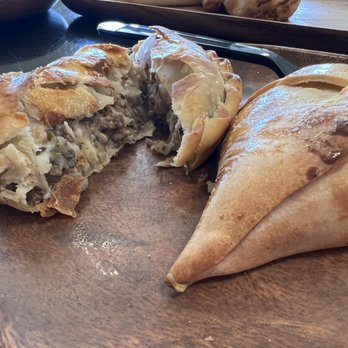 Del Campo Empanadas - Cheeseburger with filling displayed on the left and shrimp on the right - Argentine Near Me - Fort Worth, Texas