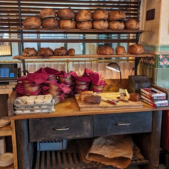 Le Suprême - This set-up reminds of Le Diplomate - crusty loaves being prepared for guests. - French Near Me - Detroit, Michigan Le Suprême - This set-up reminds of Le Diplomate - crusty loaves being prepared for guests. - French Near Me - Detroit, Michigan