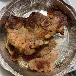This is supposed to be a fried pork chop. Never seen a SPANISH fried pork chop that looked like this. It's hard and disgusting. This is supposed to be a fried pork chop. Never seen a SPANISH fried pork chop that looked like this. It's hard and disgusting.