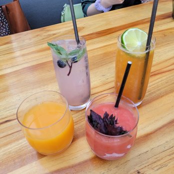 Electric Lemon - Left to right: Orange juice, Blue Thai, Artic Melon, Return to the Beach, - New American Near Me - New York, New York Electric Lemon - Left to right: Orange juice, Blue Thai, Artic Melon, Return to the Beach, - New American Near Me - New York, New York