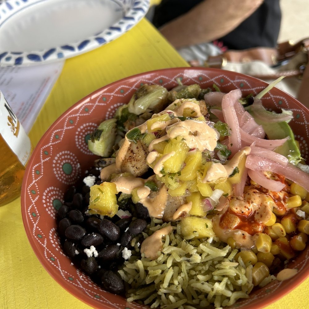 Mahi-Mahi Power Bowl: gluten free. Rice, black beans, Brussels sprouts, pickled onions, corn, cabbage, cotija and avocado. Amazing!