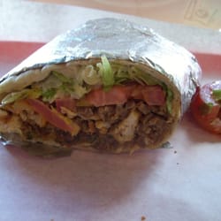 Taste Of Jerusalem Cafe - The Ultimate Sandwich! Gyros, chicken, falafel, lettuce, tomato, peperoncini (I think), and delicious sauce in warm pita bread