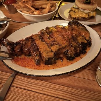Nancy's Hustle - 20 oz. Ribeye, burger and fries. - New American Near Me - Houston, Texas