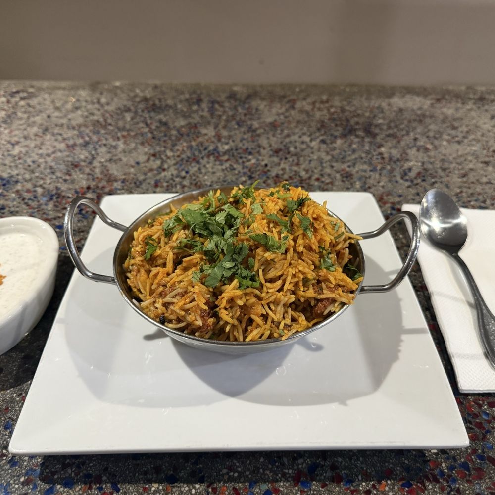 Lamb Biryani with Raita. Order spicy if you're feeling bold. Order extra Raita if you can't handle spice. Lamb Biryani with Raita. Order spicy if you're feeling bold. Order extra Raita if you can't handle spice.