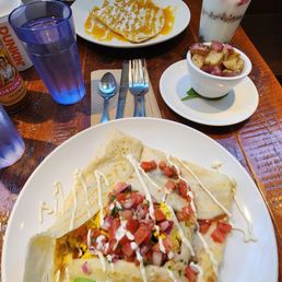 Vegan Mexican crepe, Rosemary potatoes, crepe suzette , and yogurt parfait.