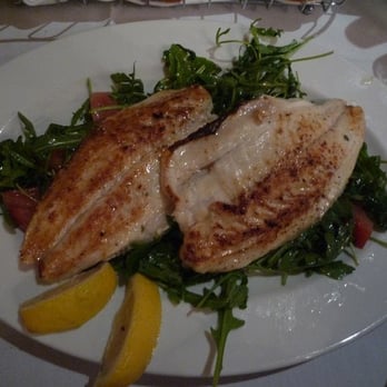 Enzo's - Enzo's sea bass on arugula. - Italian Near Me - Bronx, New York