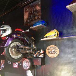 Cesar's Wings - The front end of this motorcycle is on the other side of the wall facing the street