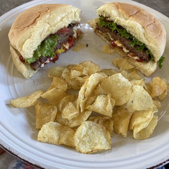 Bountiful Meats & Processing - Dressed up bacon/cheddar & green chili/mozzarella burgers with kettle chips - Pop-Up Restaurants Near Me - La Jara, Colorado