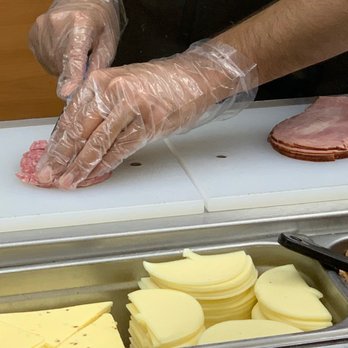 Subway - a man preparing food at a buffet - Sandwiches Near Me - Mokena, Illinois