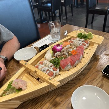 Sushi Kabuki - Assortment of rolls including Spicy Tuna, Rainbow roll, Eel roll, and yellowtail sashimi. - Sushi Bars Near Me - Herndon, Virginia