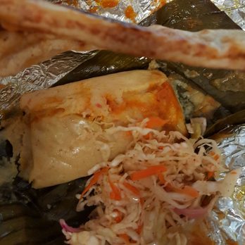 Pupusas Paradise - Cut the pork and cheese pupusa in half. - Salvadoran Near Me - Aurora, Colorado Pupusas Paradise - Cut the pork and cheese pupusa in half. - Salvadoran Near Me - Aurora, Colorado
