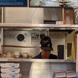 Domino's Pizza - Worker without a mask, preparing food