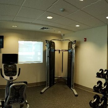 Home2 Suites by Hilton - Adequate gym with three treadmills, one recumbent, one elliptical, pulley system, dumbbells - Hotels Near Me - Livermore, California Home2 Suites by Hilton - Adequate gym with three treadmills, one recumbent, one elliptical, pulley system, dumbbells - Hotels Near Me - Livermore, California