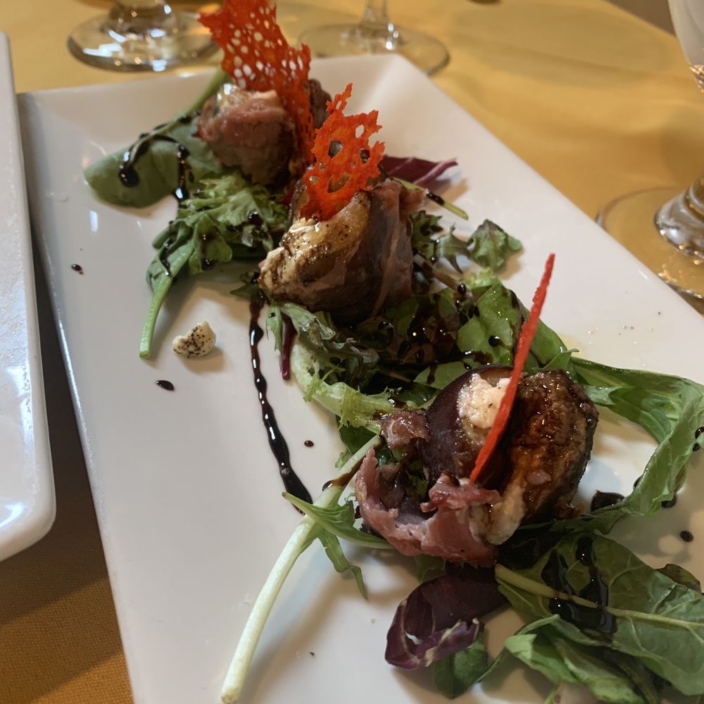 Figs stuffed with goat cheese and wrapped in prosciutto - also a special
