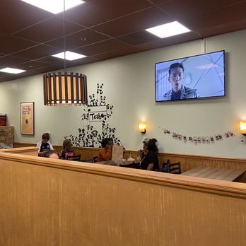 Teabo Café - people sitting at tables and watching television - Cafes Near Me - Davis, California