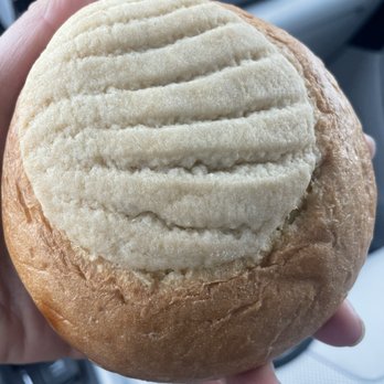 Panadería La Centroamericana - a person holding a bread roll - Bakeries Near Me - Lakewood, Colorado Panadería La Centroamericana - a person holding a bread roll - Bakeries Near Me - Lakewood, Colorado