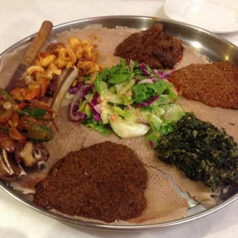 Demera - Messob #18  Spicy lentils, Spicy Chickpeas, Chopped Spinach, Beef, Lamb & Shrimp - Ethiopian Near Me - Chicago, Illinois
