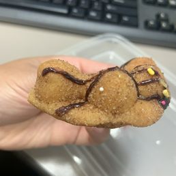 Chocolate drizzle churro. Small and not fully formed and rounded like the actual mochinut.