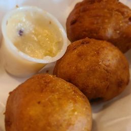 Their Hush Puppies are filled with creamy, delicious goat cheese, improving upon a side dish that is sometimes dry in other restaurants.