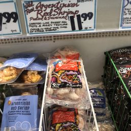 Wild pink Argentine shrimp (11.99) an option. - Frozen Argentine red shrimp are packaged in plastic bags and displayed on a store shelf at Trader Joe's in Concord, CA.