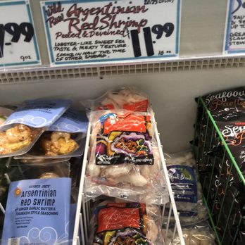Trader Joe's - Wild pink Argentine shrimp (11.99) an option. - Frozen Argentine red shrimp are packaged in plastic bags and displayed on a store shelf at Trader Joe's in Concord, CA. - Grocery Near Me - Concord, California
