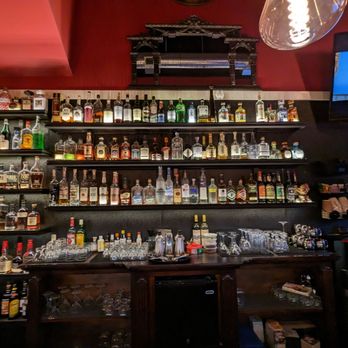 Dinner House - a bar full of alcohol bottles - Beer Bar Near Me - Oakland, California