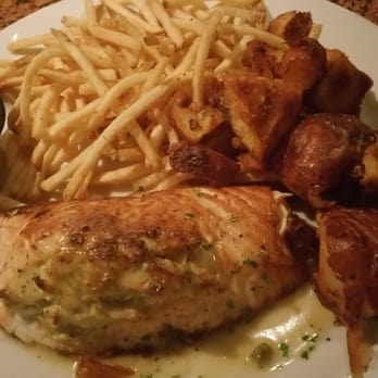 Freda's Seafood Grille - Crab Stuffed Salmon with matchstick fries AND roasted red potatoes because I'm a lover of all things potato - Seafood Near Me - Austin, Texas