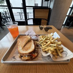 Steak and cheese melt with a side of fries Steak and cheese melt with a side of fries