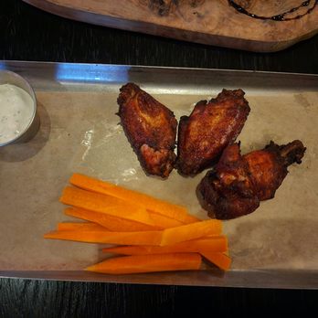 Voodoo Bayou - Smoked Wings (comes with celery and blue cheese--must order 3) - Cocktail Bars Near Me - Orlando, Florida Voodoo Bayou - Smoked Wings (comes with celery and blue cheese--must order 3) - Cocktail Bars Near Me - Orlando, Florida
